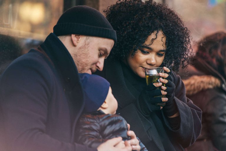 A family having coffee outside.