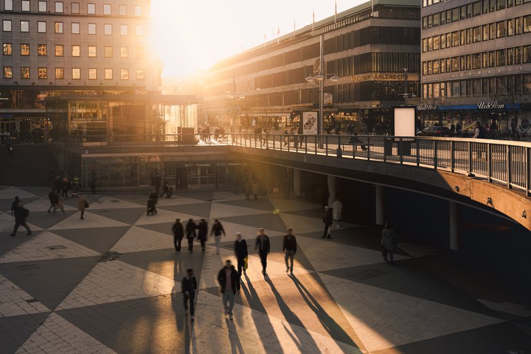 The vibrant, black- and white tiled central square Sergels Torg flooding in sunlight