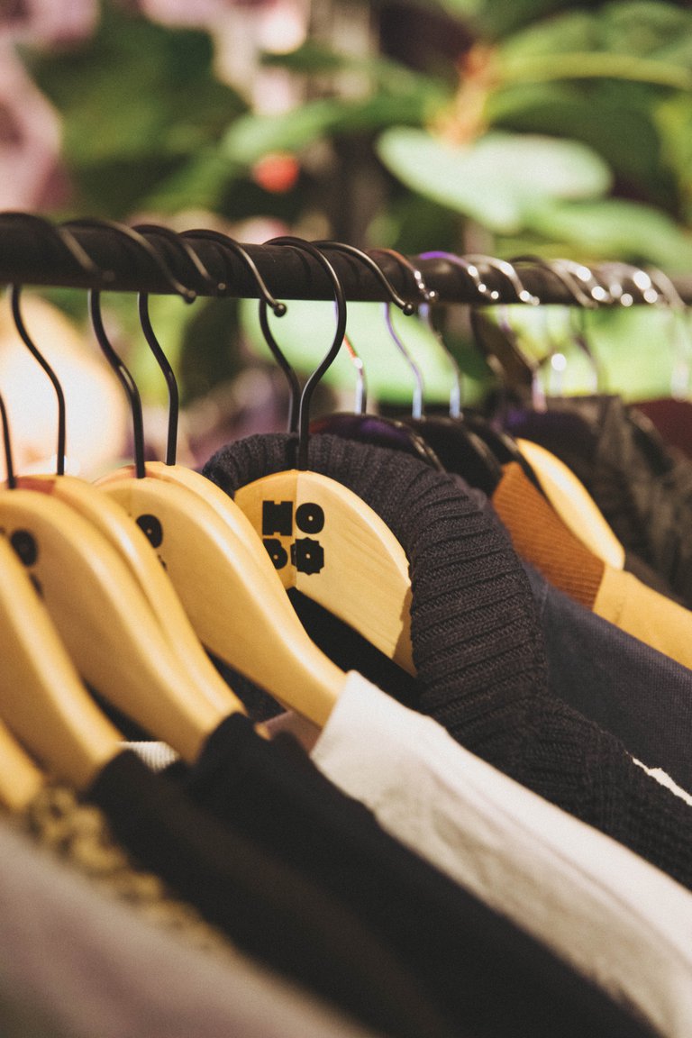 Clothes hanging on a clothes rack.