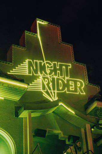 The text "Night rider" in green neon light.