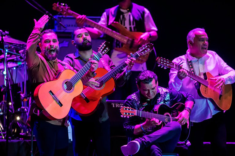 The band Gipsy Kings playing on a stage.