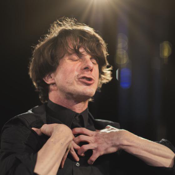 An actor performing on a stage.