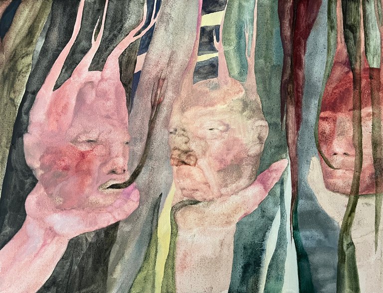 A painting depicting three faces.