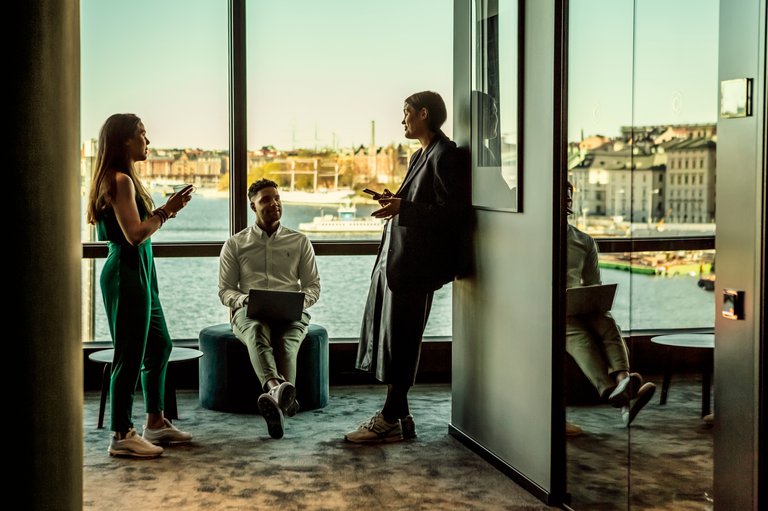 People at a coworking space in Stockholm with panoramic view over the city