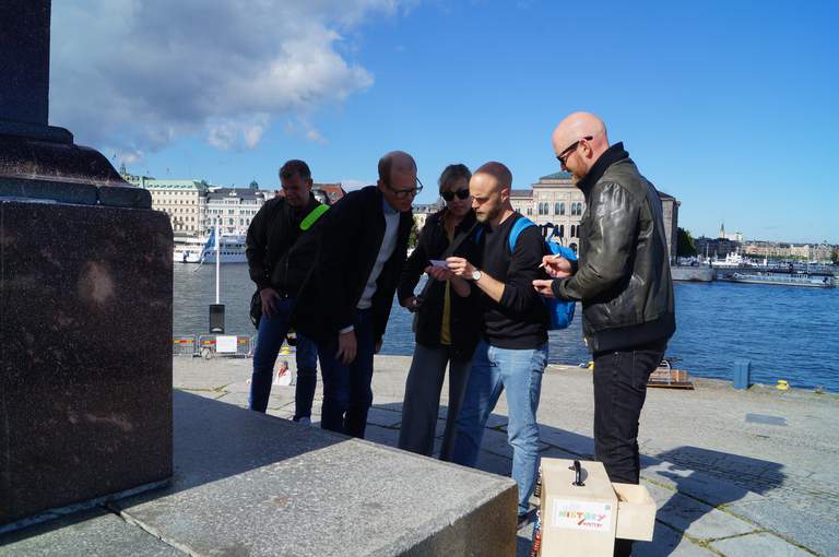 A group of people on a historical mystery tour in Stockholm.