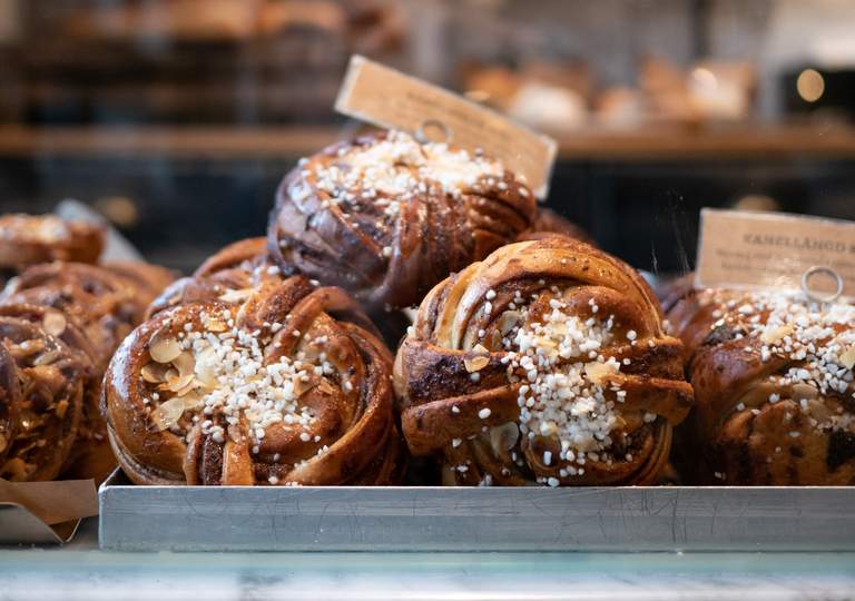 Cafees in Stockhoilm. Close-up of a tray of cinnamon buns at Robin Delselius Bageri in Enskede.