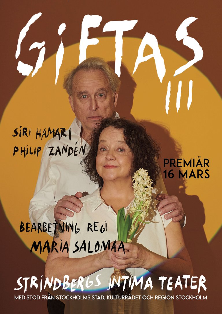 a woman with flowers and a man standing behind her