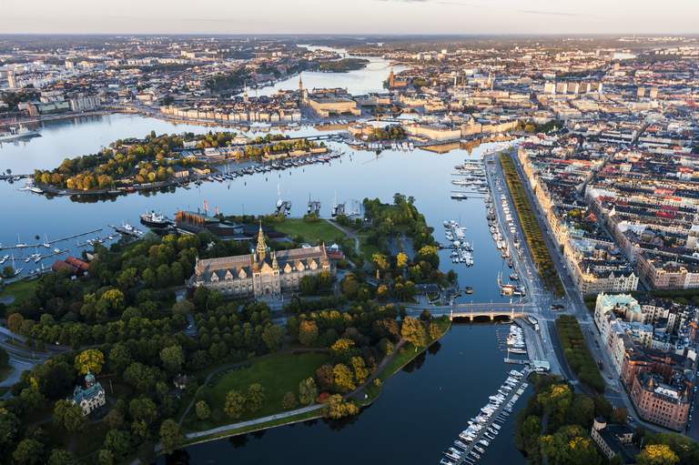 An aerial photo of Stockholm's inner city and its islands, with the Royal Djurgården in the foreground