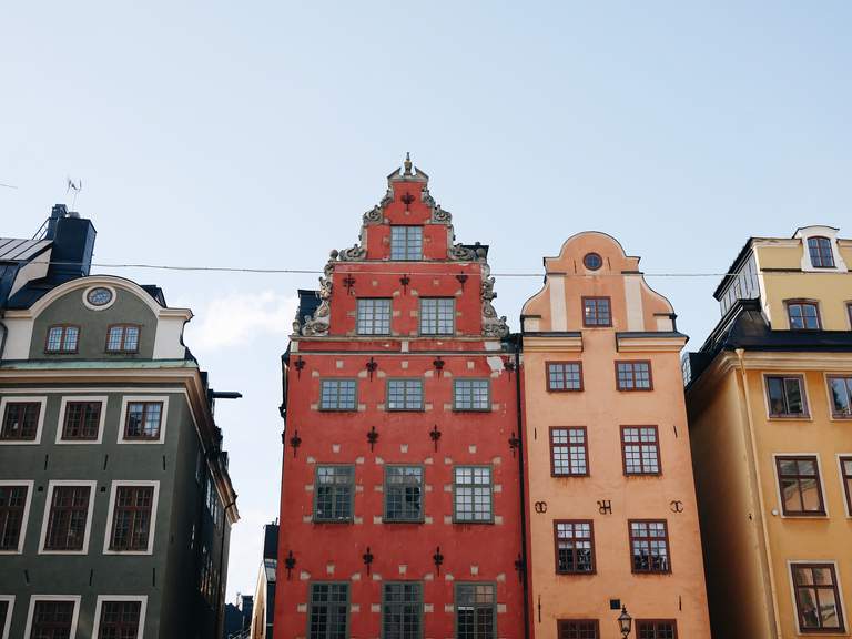 The colorful, old buildings in Stockholm's oldest square Stortorget are painted in green, red, orange and yellow
