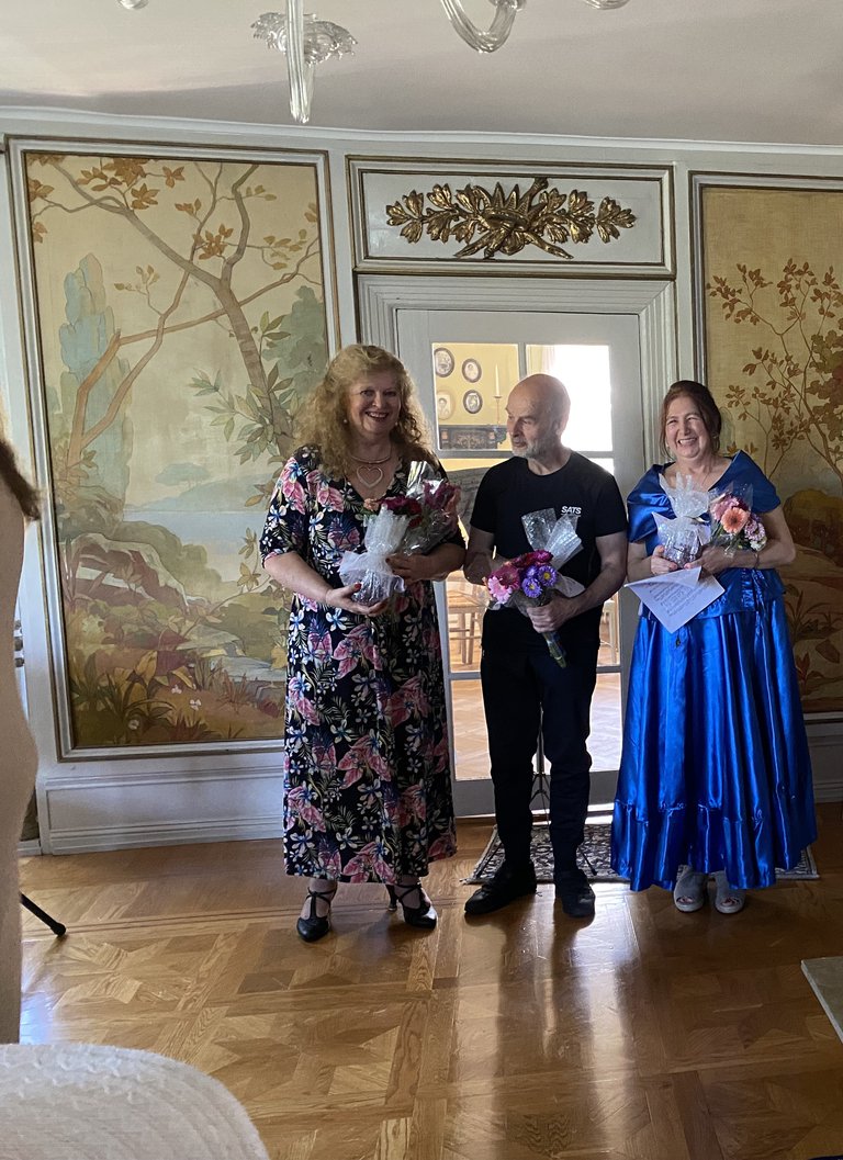 The musicians with flowers.