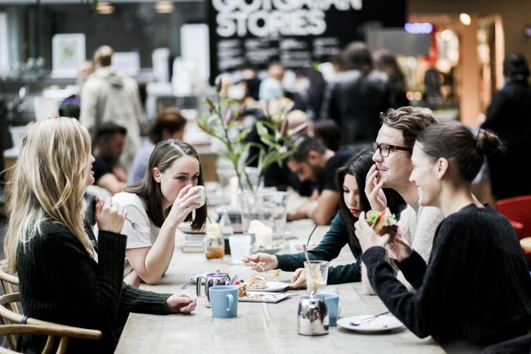 A group of friends sit at Stories Café in the Skrapan shopping mall on Södermalm in Stockholm.