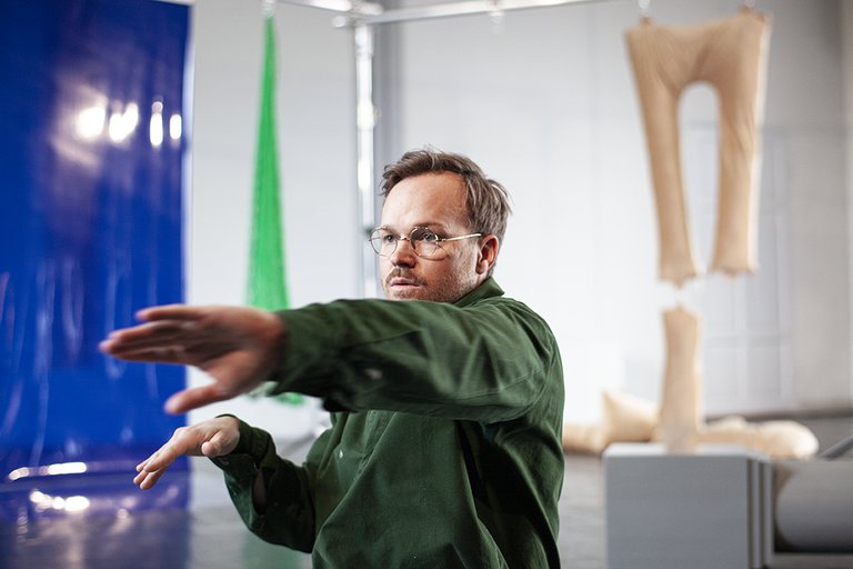 person wearing green shirt and glasses