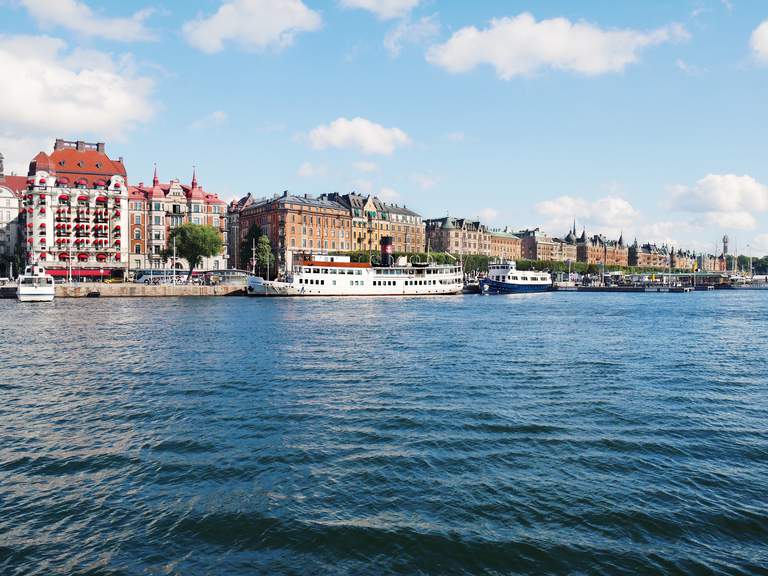 A sunny summer day in central Stockholm. Beautiful old buildings along the water.