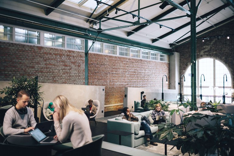 People sit working at a co-working space in Stockholm