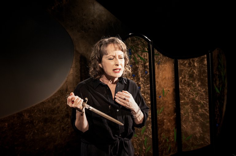 A woman with a knife.
