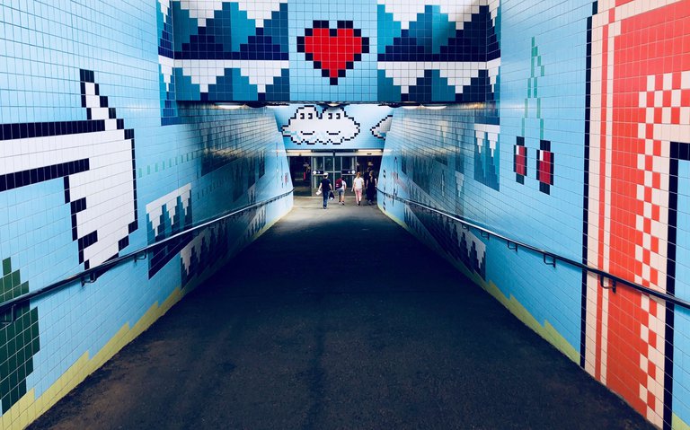 Thorildplan’s subway station in Stockholm. The station is above ground and its art inspired by ‘80s video games. Pictured is the tilework that is reminiscent of pixelated clouds and mushrooms in Super Mario Bros.