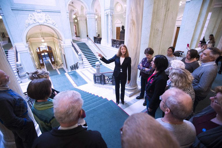 Guided Tour of the Riksdag; a guide and a group of visitors