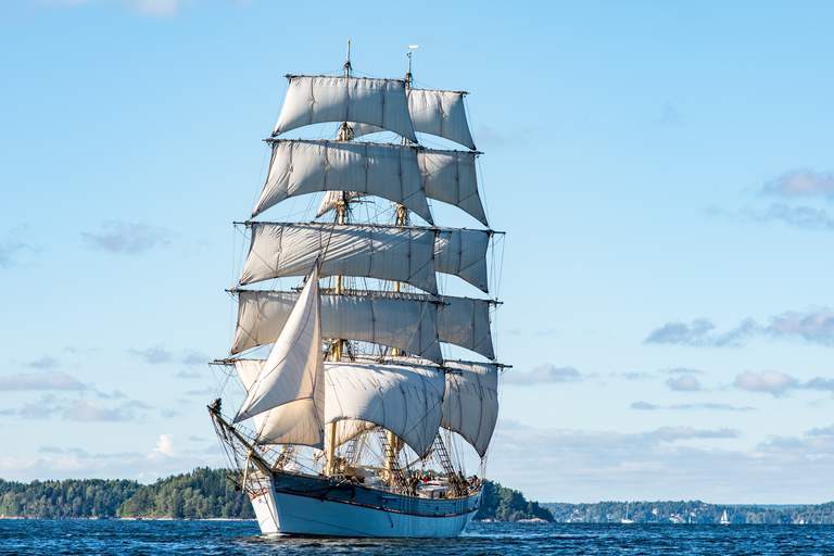 Activities in Stockholm. Tre Kronor, a massive brig is sailing on the waters of Stockholm.