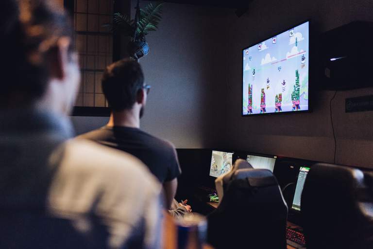 Bars in Stockholm. A group of people are playing the video game 'Tricky Towers' at Kappa Bar, a game themed bar in Vasastan.