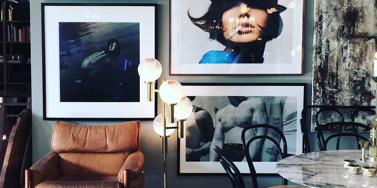 The vintage boutique Dusty Deco in Stockholm. Armatures in copper, leather furniture and a collection of large framed photographs can be seen on the picture. The Dusty Deco-gang has only one rule – the only objects for sale are the ones they’d like to have in their own home.