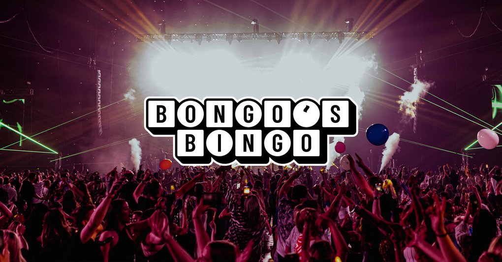 A large crowd at a Bongo's Bingo event with dramatic stage lighting and confetti