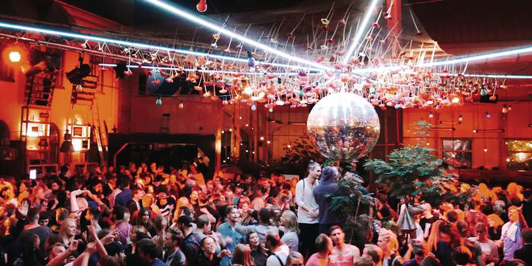 A packed dance floor during a club night at one of Stockholm’s most popular summer clubs; Trädgården. The open-air club at Södermalm frequently books some of the world’s biggest names in electronic dance music.