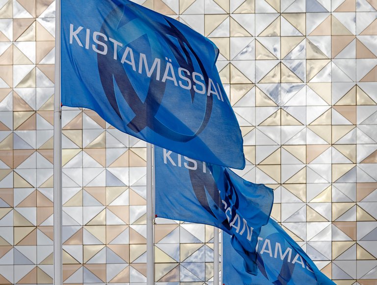 Architecture in Stockholm. Blue flags bearing the logo of Kistamässan convention center.
