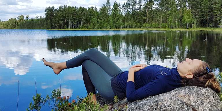 Karin Skelton, nature-lover, takes a break by a lake in Sweden.