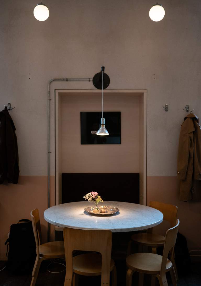 Cafees in Stockholm. A lamp hanging over a table at the centrally located Gast in Stockholm.