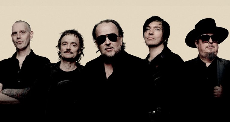 The five members of Gluecifer, all dressed in black.