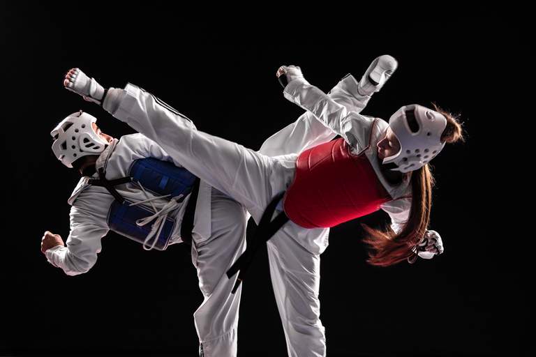 Two persons competing in Taekwondo Championship.