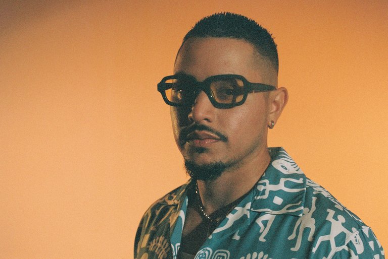 A man with glasses and a neat beard.