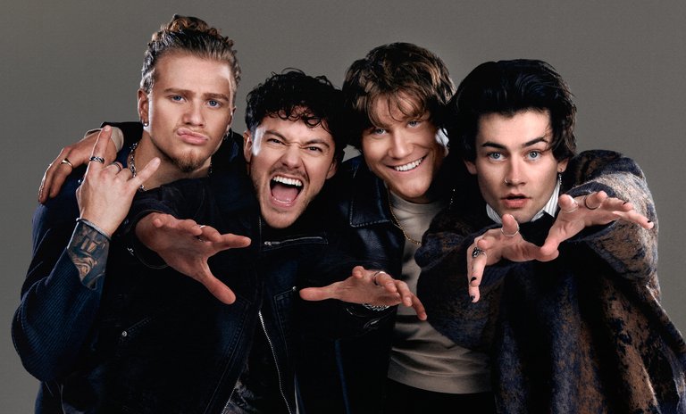 The four members of Midnight Til Morning making excited faces.