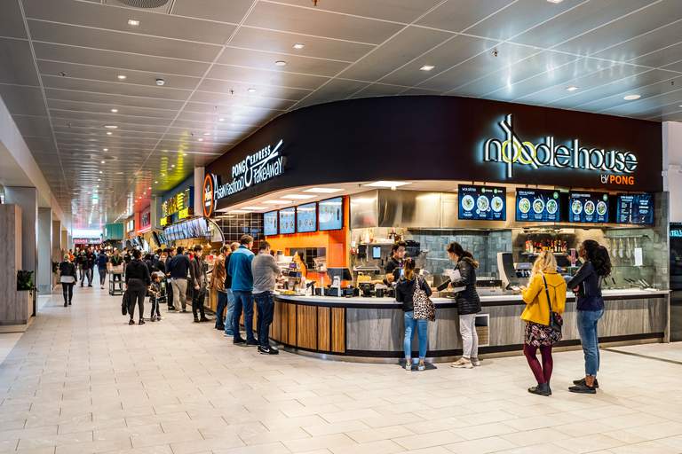 Shopping malls in Stockholm. The food court at Kista Galleria in northern Stockholm. People are looking at the menu at Noodle house.