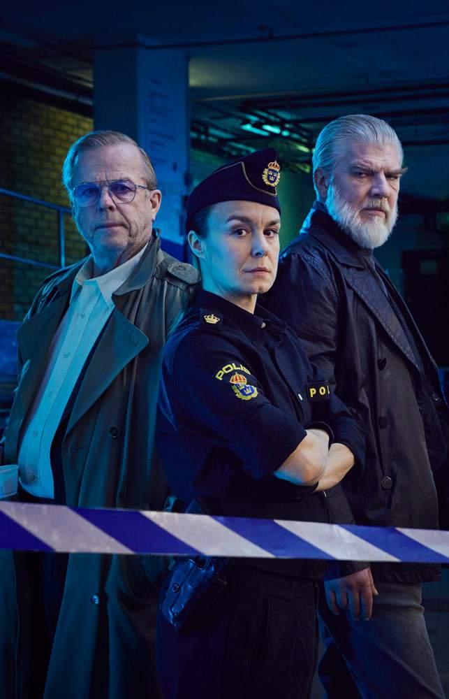 Two men in civil clothes and one woman in police uniform.