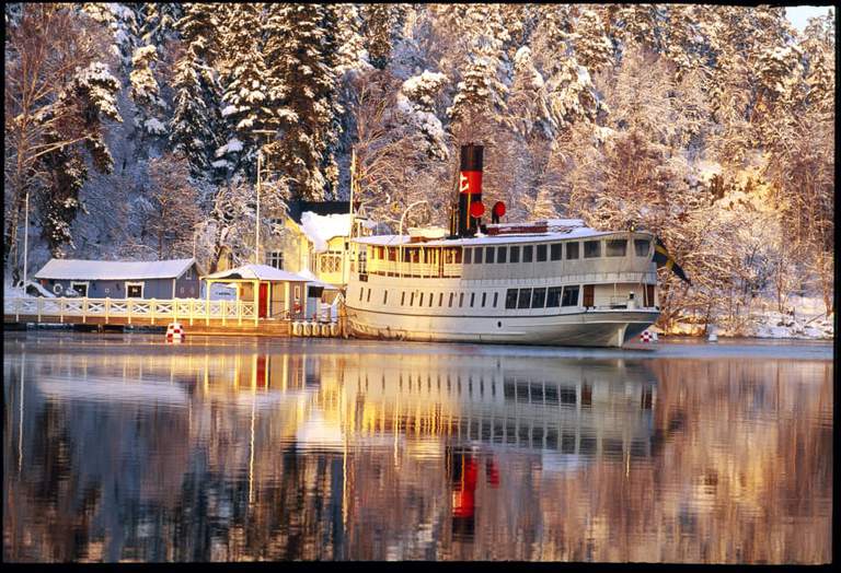 A winter landscape with a boat.