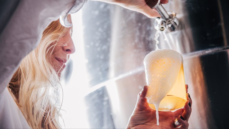 Hedda Spendrud pours up a glass of beer at Omaka brewery in Stockholm.