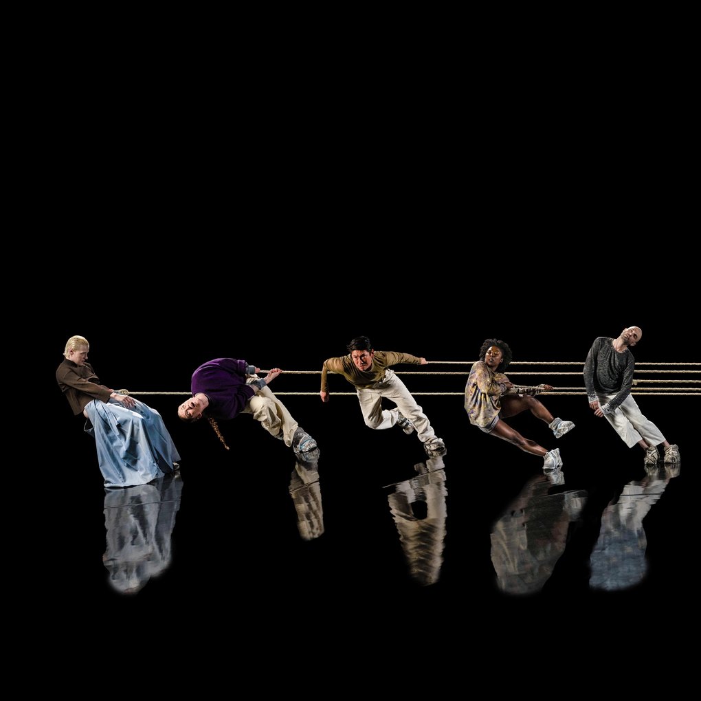 Dancers performing REMACHINE on a stage.