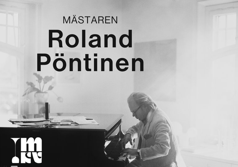 A musician playing the grand piano.