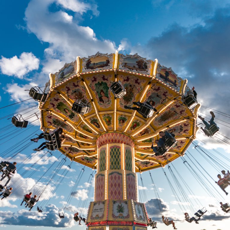 Attractions in Stockholm. An old carusel at Gröna Lund Amusement Park on Djurgården. Summer. Blue Sky.