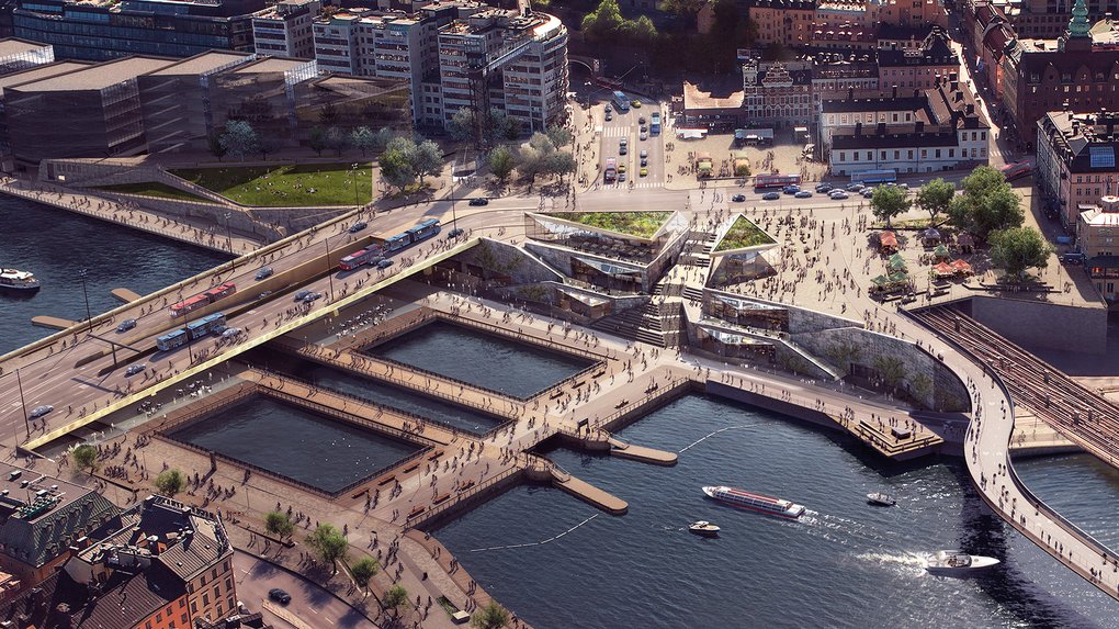 Birds' eye view of the Slussen area, with different bridges crossing the waters to the square Vattentorget.