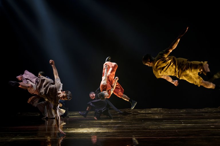 Dancers on a stage performing Sol Invictus.
