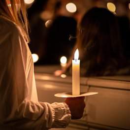 a person holding a candle