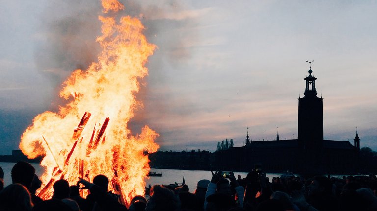 Walpurgis bonfire in Stockholm. The Stockholm City Hall is visible in the disstance.