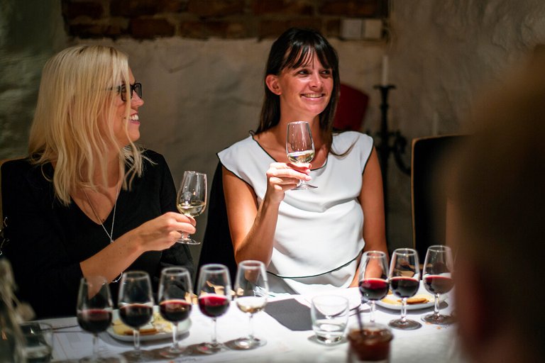 Two women tasting wines.